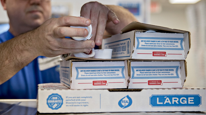 domino's pizza boxes with sauce