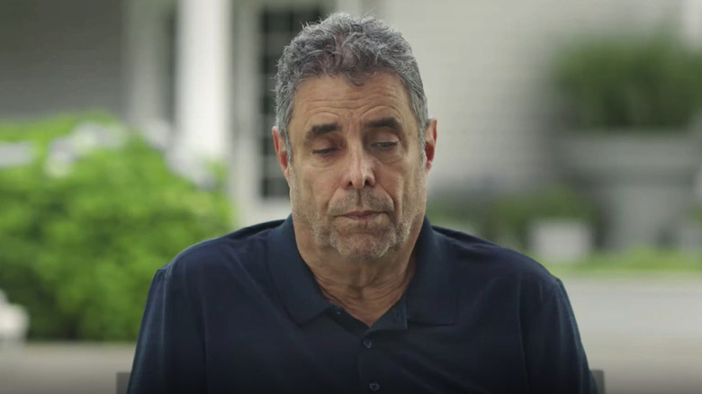 Jeffrey Chodorow looking down with serious expression