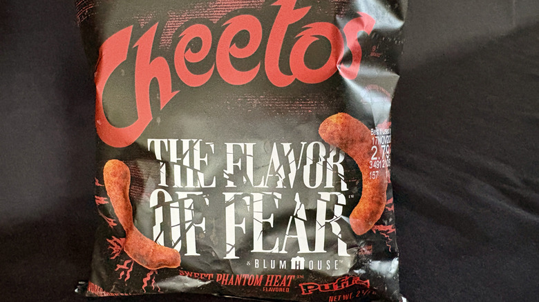 A close up of a Cheetos Sweet Phantom Heat Puffs bag
