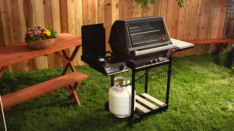 Gas grill in backyard