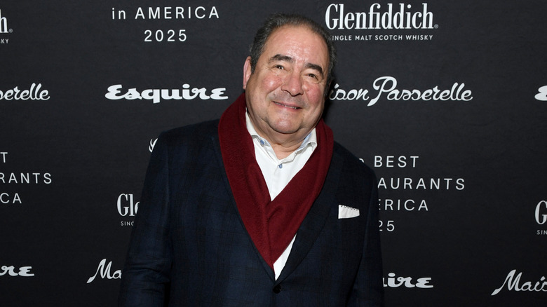 Emeril Lagasse smiling at a red carpet event