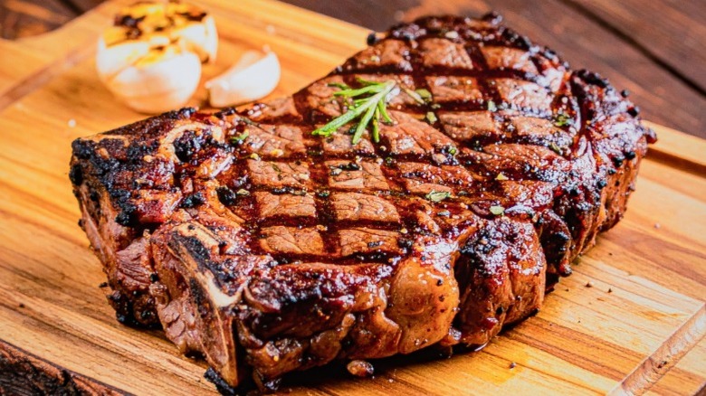 Grilled ribeye steak on a cutting board