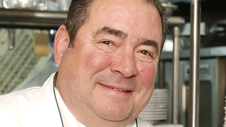 Emeril Lagasse smiling in kitchen