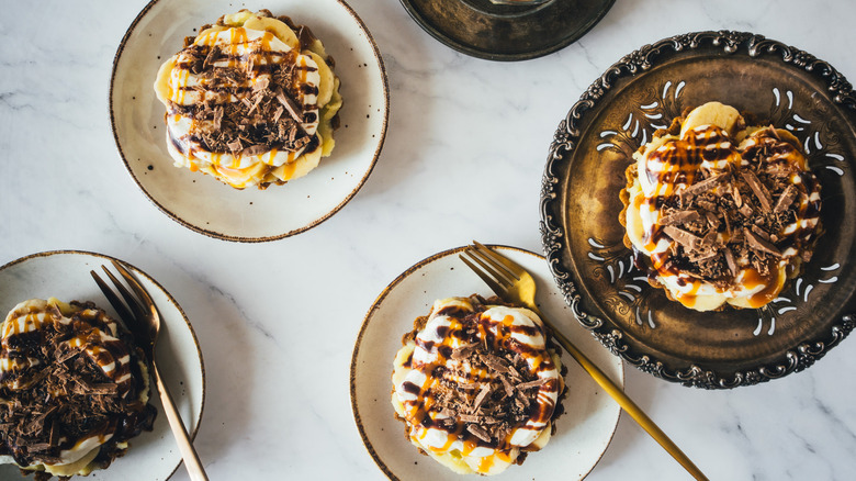 four banana pies on plates