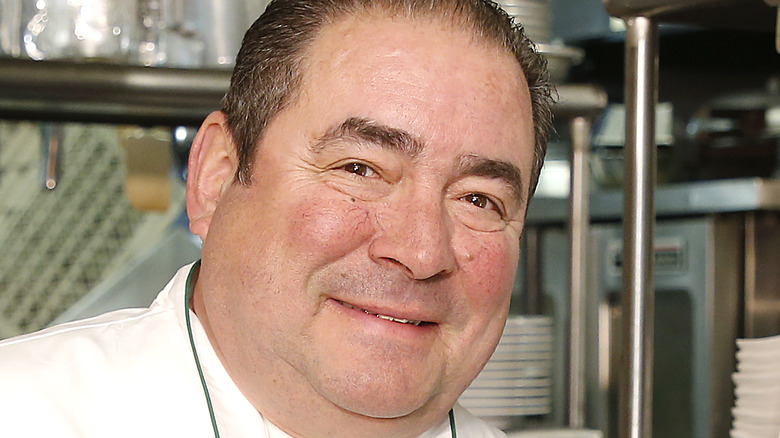 Emeril Lagasse smiling in kitchen