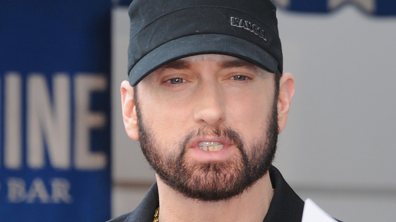 Eminem with black hat up close