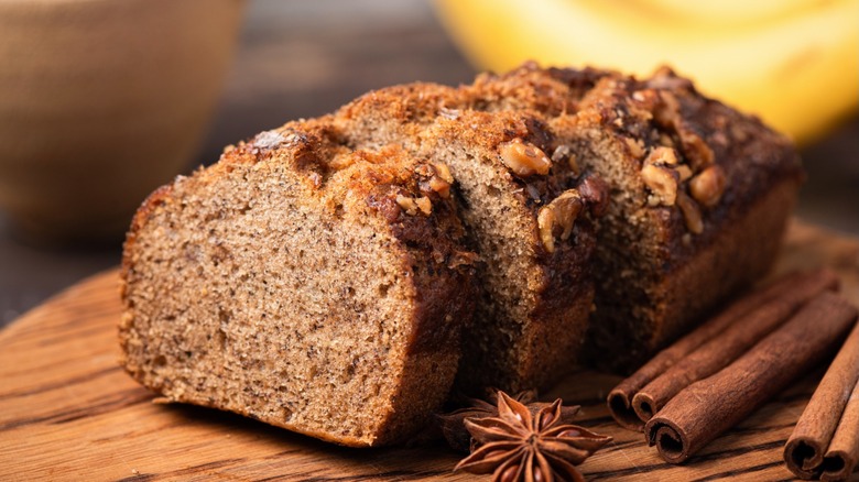 Sliced banana bread on a wooden cutting board