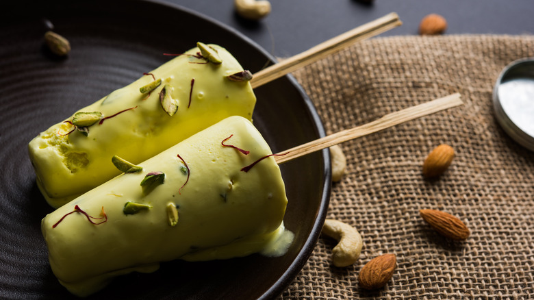 Kulfi on a stick with pistachios and almonds
