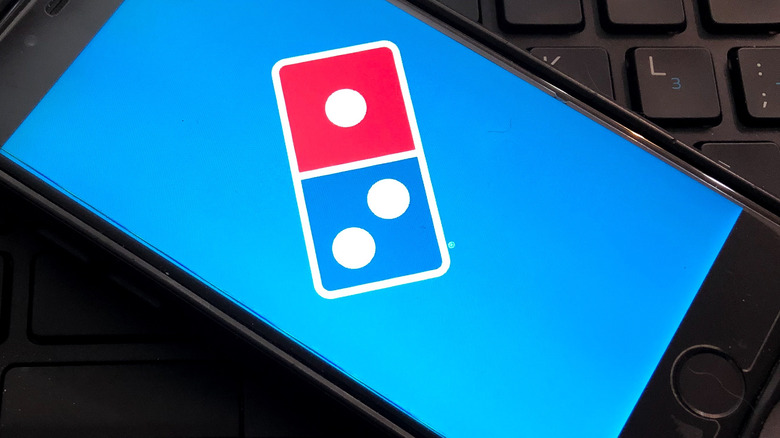 Domino's logo on smartphone