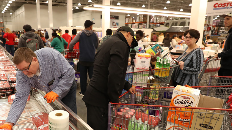 Queues of Costco customers buying groceries