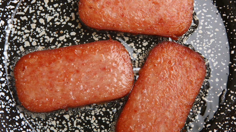 Spam slices in a frying pan