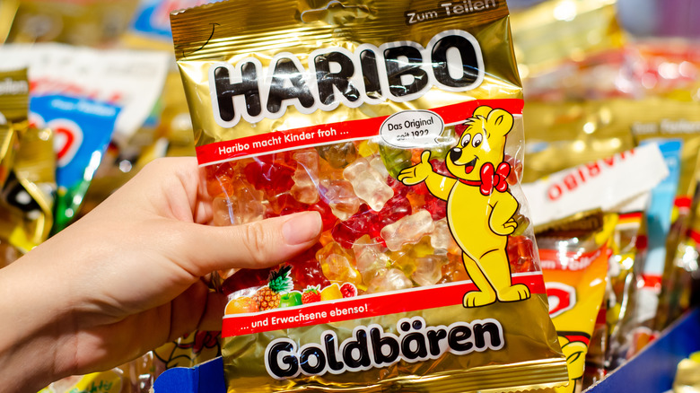 Hand holding Haribo gummy bears
