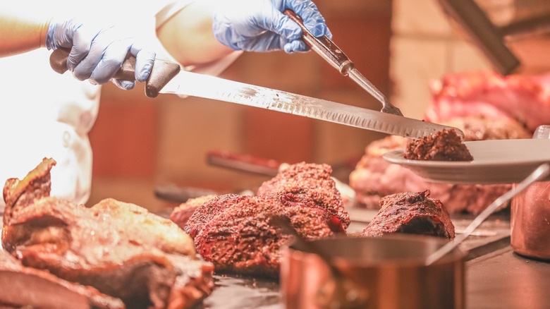 buffet chef serving carved meat