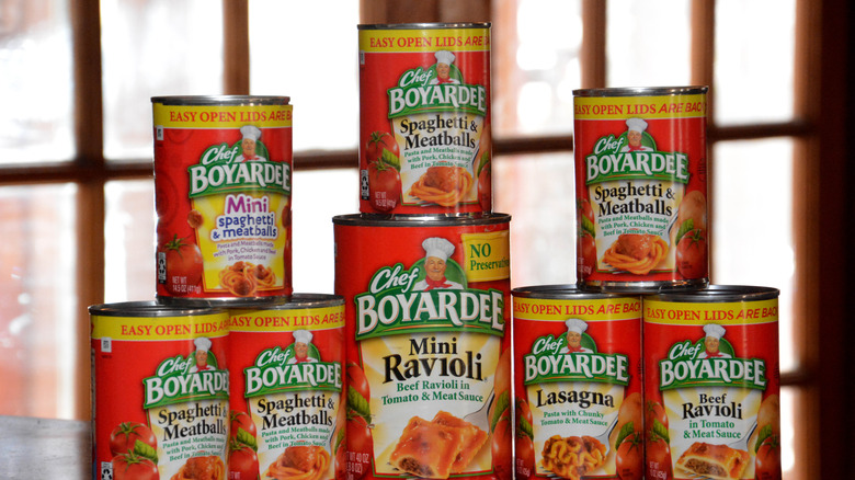 stack of cans of various sizes of Chef Boyardee