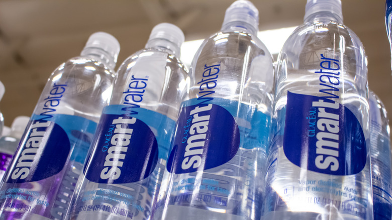 Several bottles of smartwater on store shelves