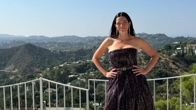 Trish Spencer in gown on balcony