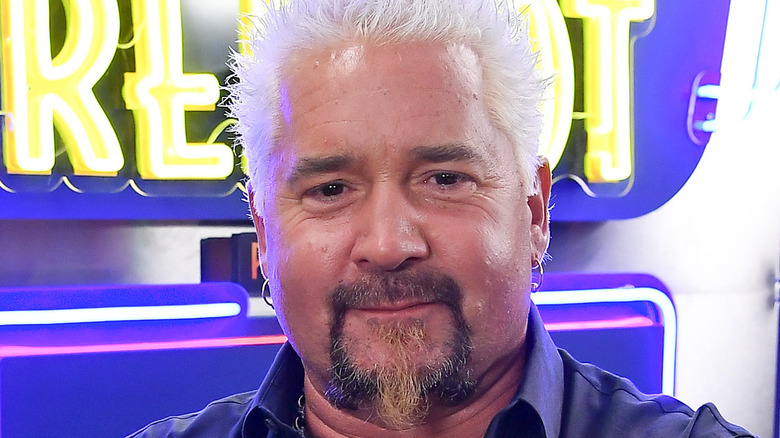 Guy Fieri wearing earrings closeup