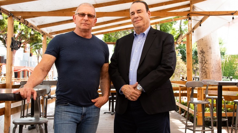 robert irvine and jon taffer posing in a still for restaurant rivals