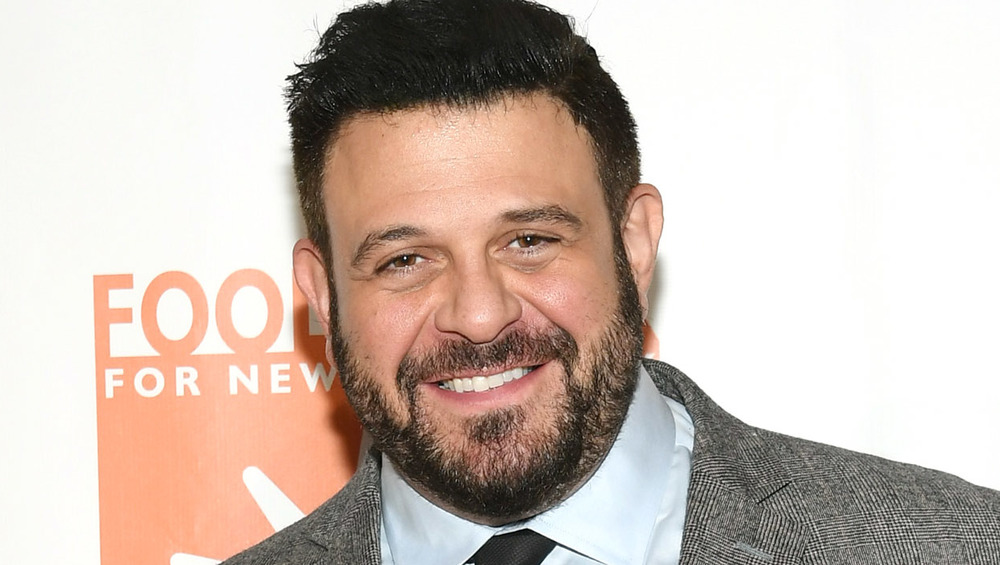 Chef Adam Richman in a suit