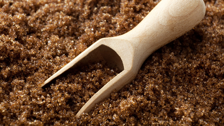 wooden scoop in brown sugar