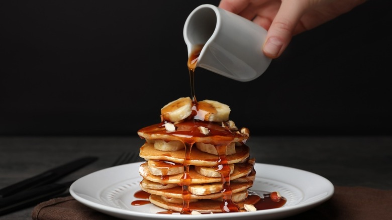 Syrup drizzled on pancake stack