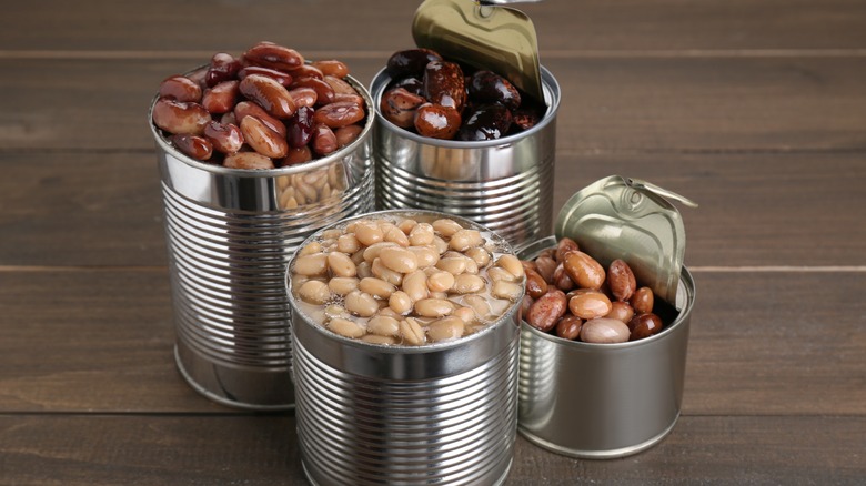 variety of opened canned beans