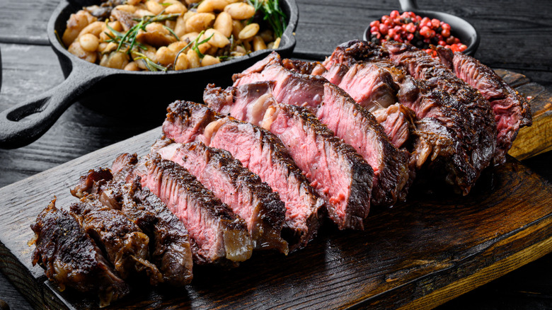 Slices of tender steak on a cutting board