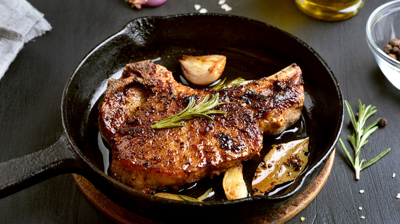 Seared steak in an oiled cast iron pan
