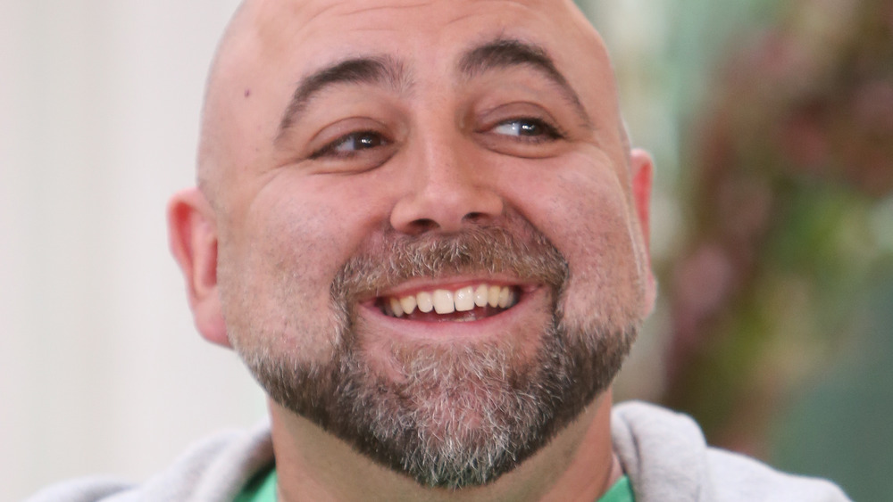 Duff Goldman smiling in green tshirt