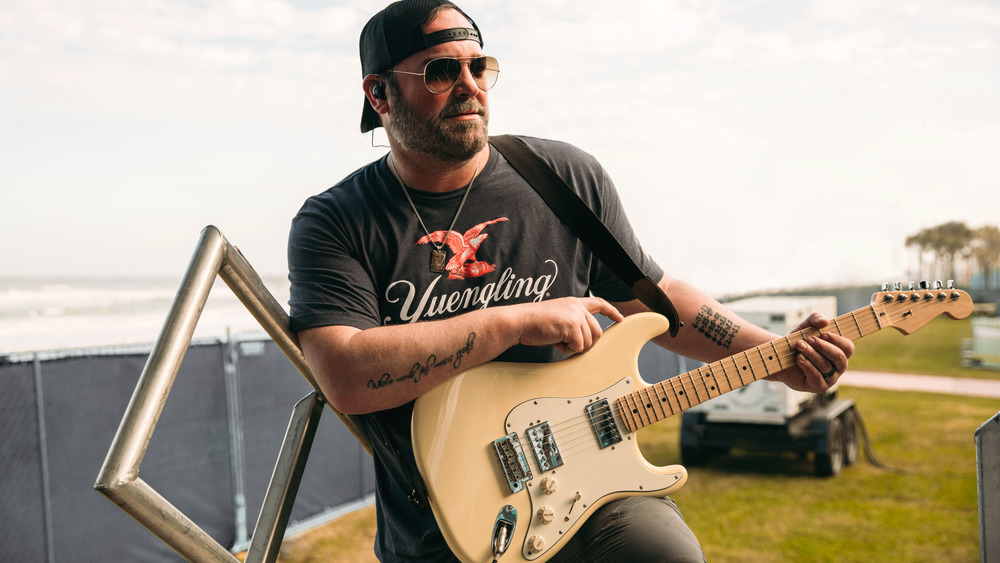 Lee Brice holding guitar