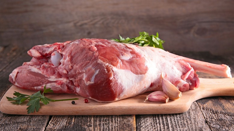 leg of lamb on cutting board