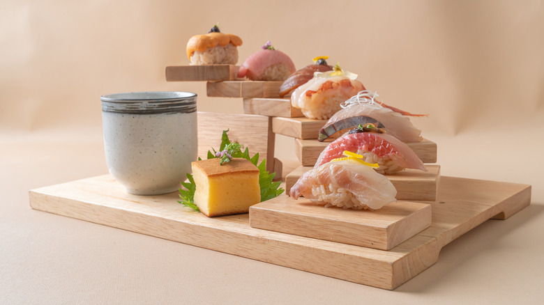 assortment of nigiri on a tray