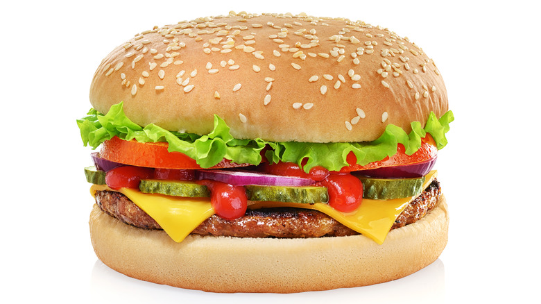 Pickles perfecting a hamburger