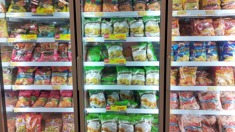 bags of frozen chicken nuggets in freezer section