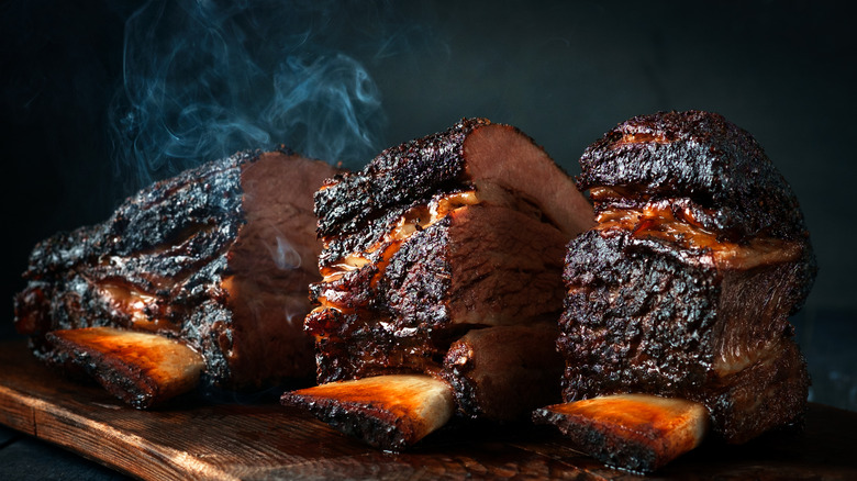 Smoking slabs of beef brisket