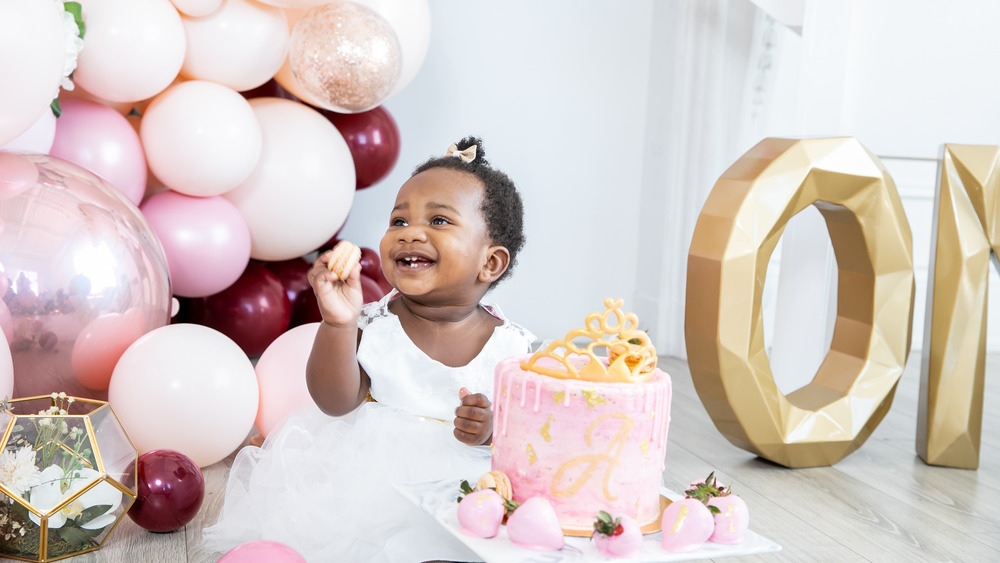 little girl with smash cake