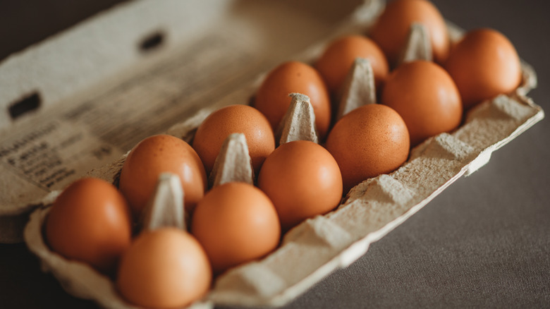 Brown eggs in a brown carton