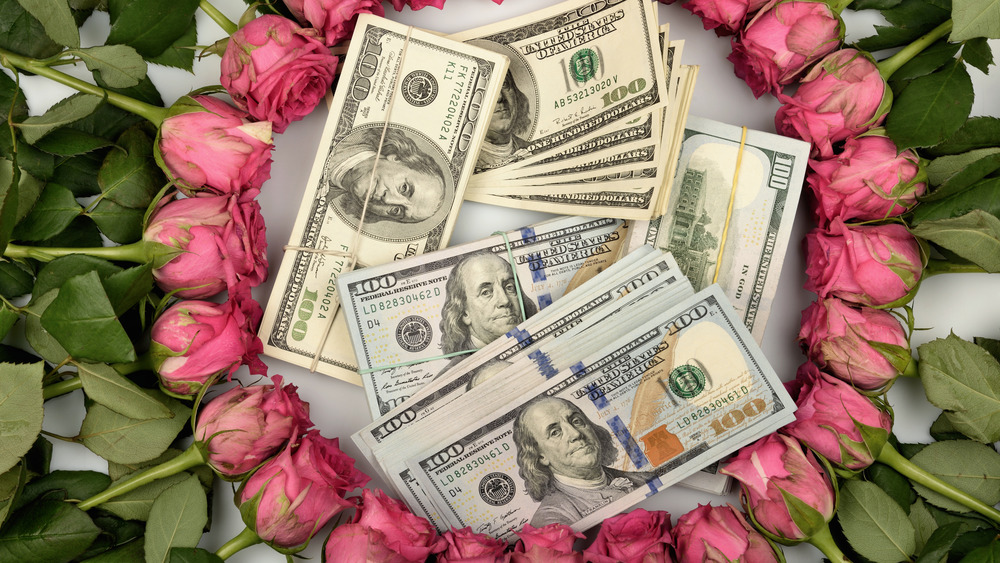artistic picture of dollars and roses 