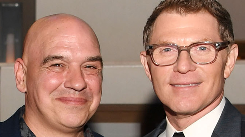 Michael Symon and Bobby Flay smiling