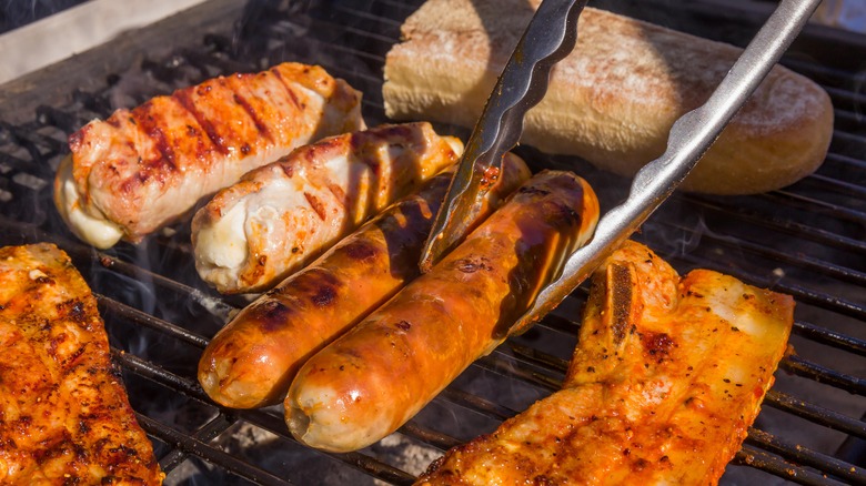 Sausages and meat on the grill