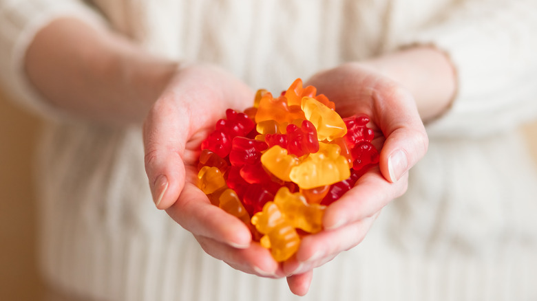 woman holding gummies in hands