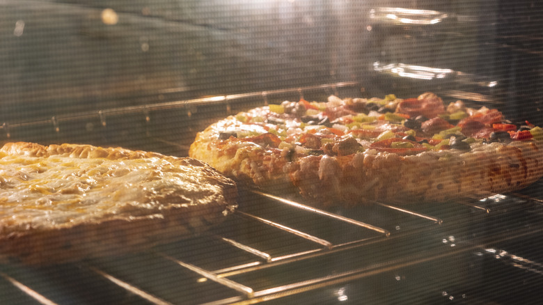 pizza baking in oven