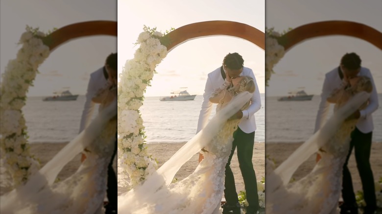 Tineke Younger and Antoine Wright Jr. kiss on the day of their wedding