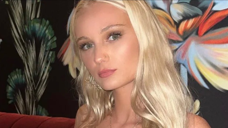 Tineke Younger at a bar with a drink in her hand