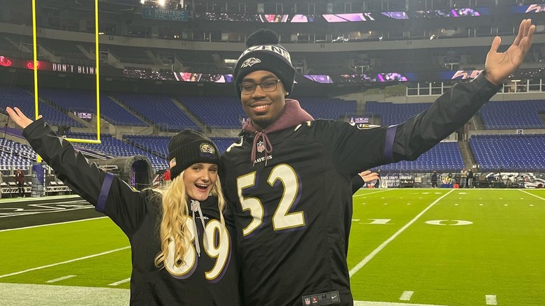 Tini Younger and Antoine Wright Jr. pose for a photo at the Ravens vs Bengals match in November 2023