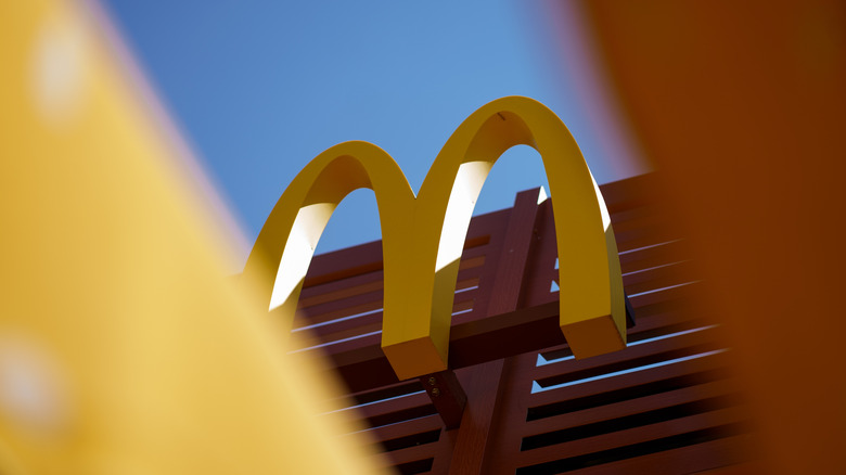 A photo of the famous McDonald's logo taken against the sky