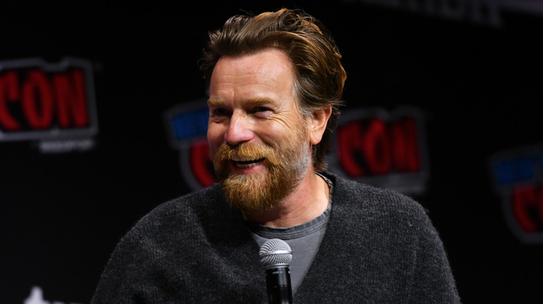 Ewan McGregor smiling with microphone