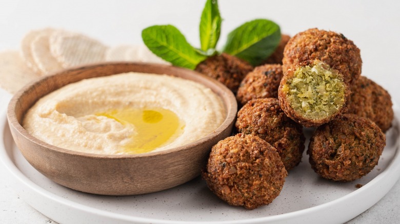 Falafel balls with bowl of hummus