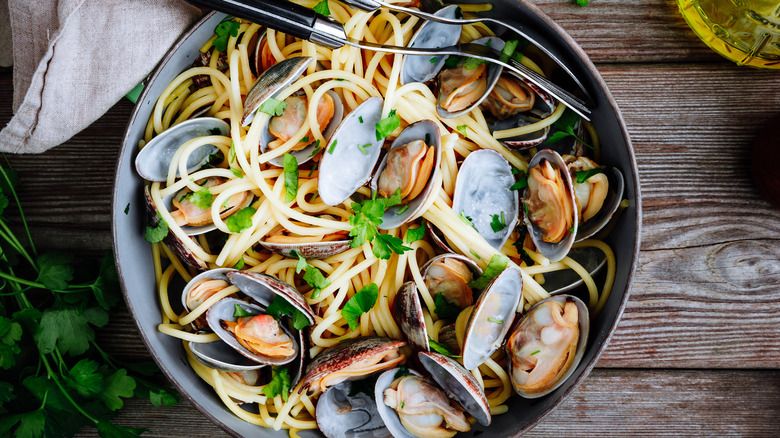 spaghetti vongole on rustic table