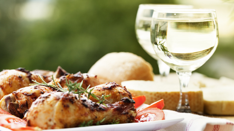 chicken and wine in outdoor setting